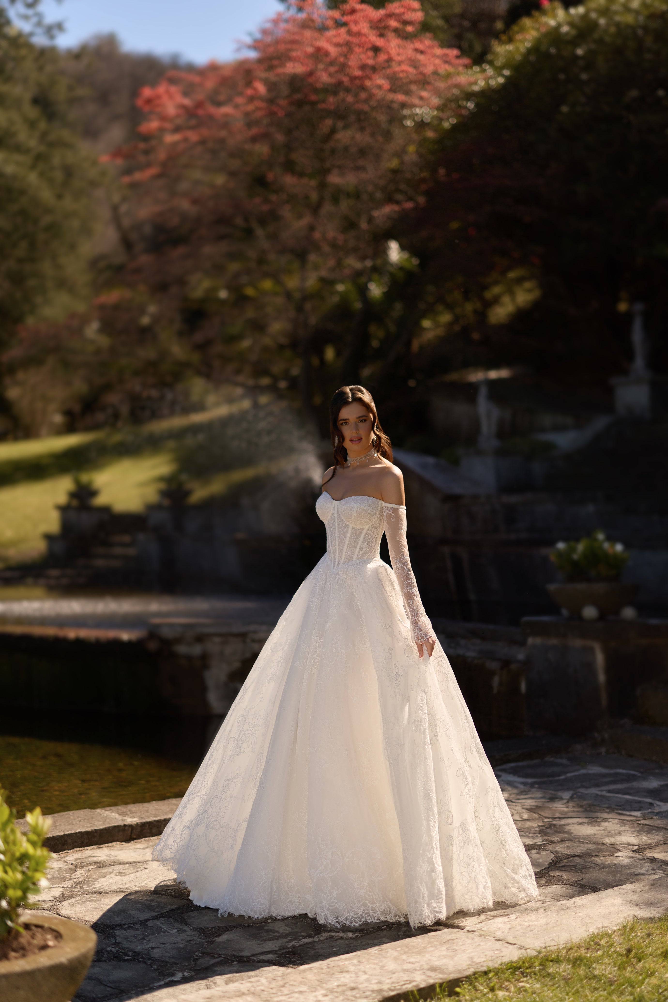 Lia-shimmering-lace-ballgown-wedding-dress-long-sleeves-exposed-boning-corset